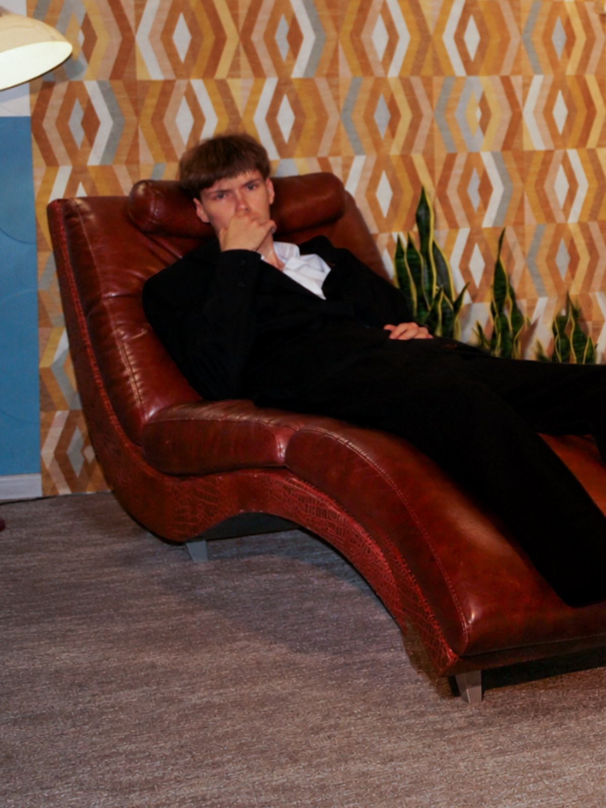 Andrew Darden, seated in a lounge chair.